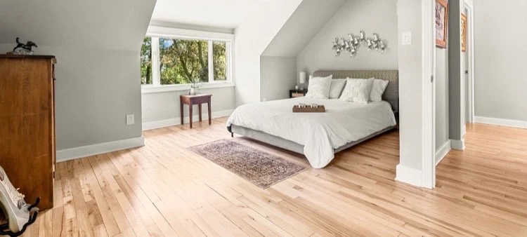 Freshly finished maple floor in a bright bedroom