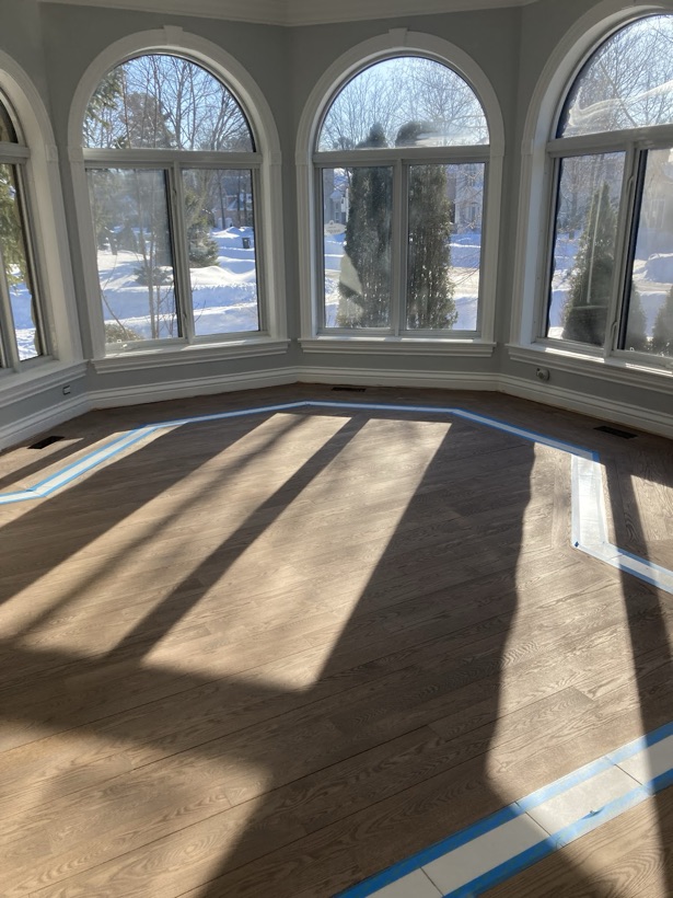 Bay-window floor · dark stain — Planchers Locas