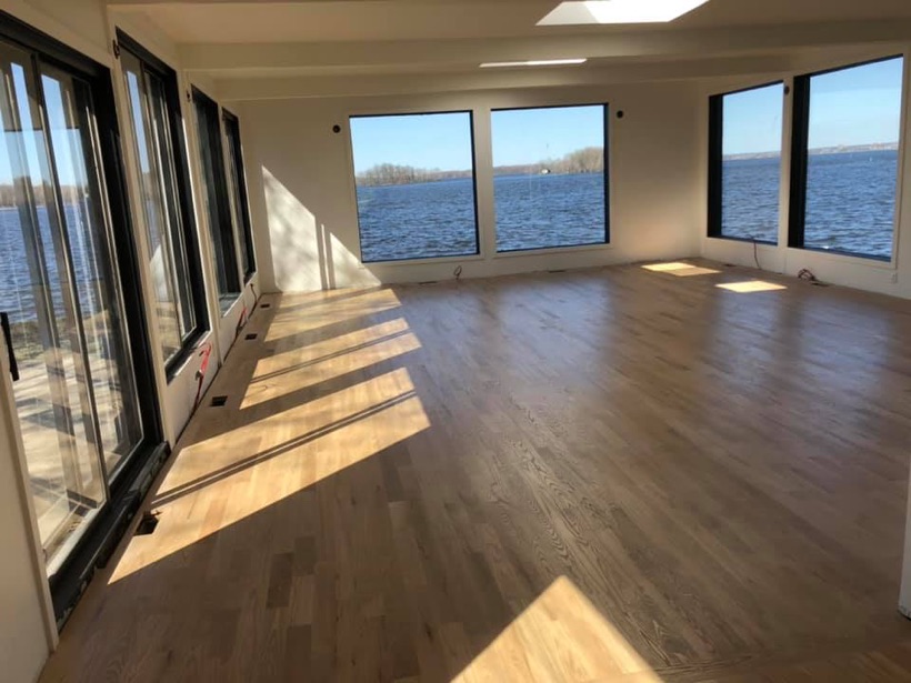 A refinished hardwood floor in a newer West Island home