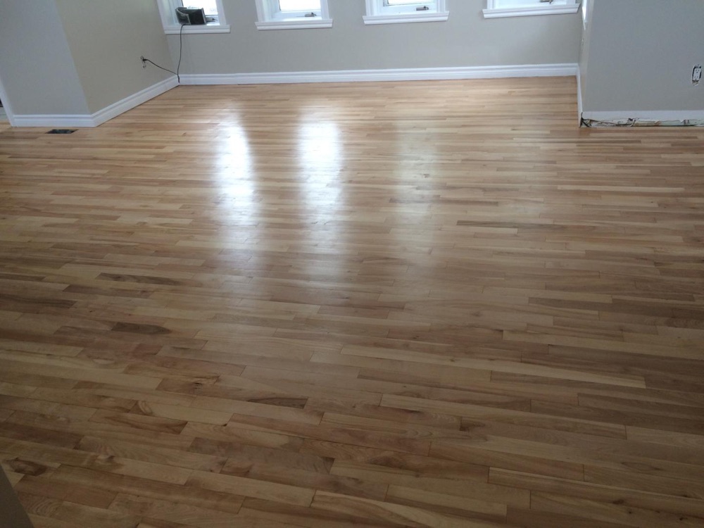 Glossy refinished floor — Planchers Locas